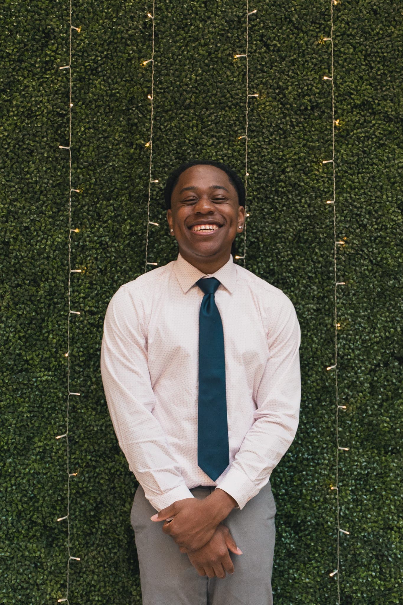 Rep in white shirt + tie, big smile
